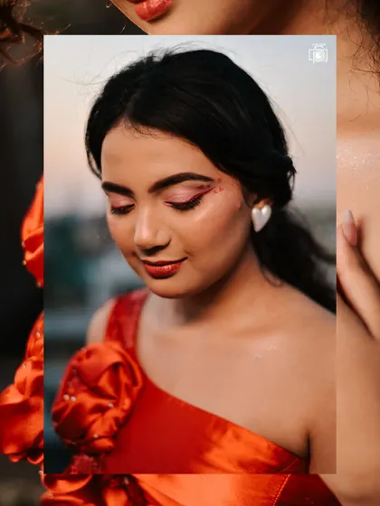 A creative close-up focusing on the unique Valentine's themed eye makeup. The framing draws attention to the artistic details and the soft texture of the red dress.