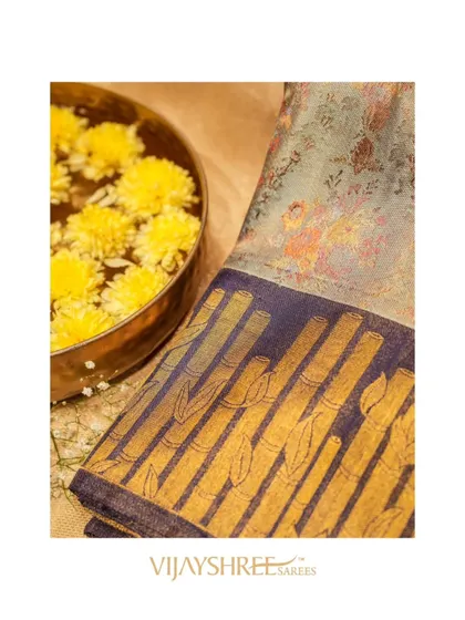 The soft, muted tones of this floral Kanjivaram make it a sophisticated and elegant choice.