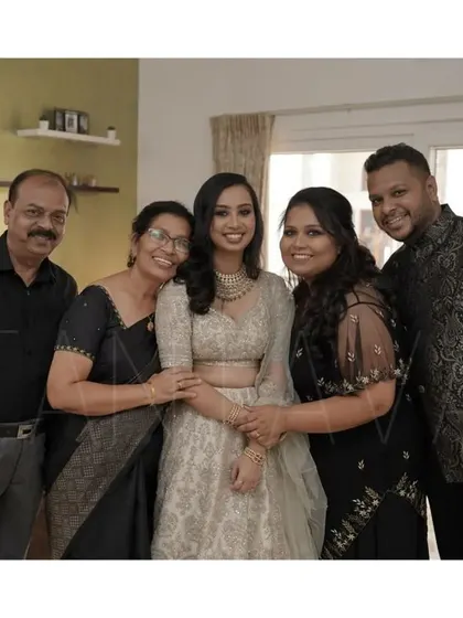 The whole family dressed in a classic black and cream color scheme. My designs for the women helped create this elegant and coordinated group look.