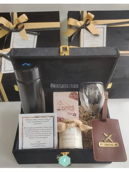 Showing appreciation for your team's hard work is so important. These customized employee gift hampers in premium black suede boxes are a great way to acknowledge their dedication and achievements.