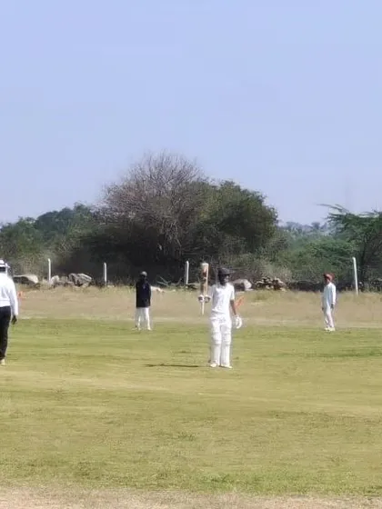 A match in progress on a rustic ground during our tour of Chitradurga.