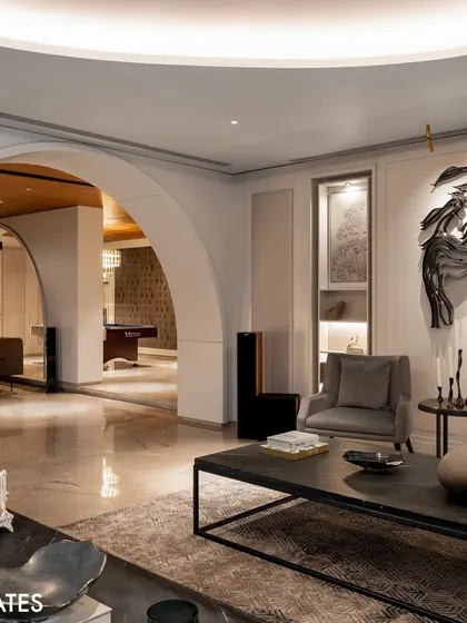 Arched doorways create a soft, classical contrast to the modern interiors, leading the eye through different zones of the home while maintaining an open feel.