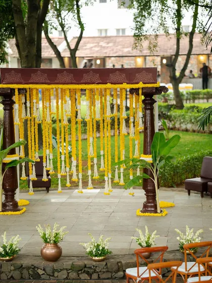 This engagement decor at Angana the Courtyard celebrates love and sustainability. I used eco-friendly materials to create a traditional yet sophisticated setup, featuring a beautiful floral backdrop and elegant seating.