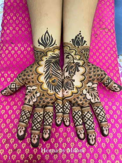 A festive design for Diwali. The central peacock feather and lotus motifs are surrounded by delicate patterns, perfect for the festival of lights.
