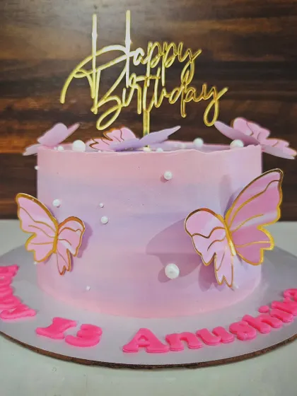 Beads and butterflies for Anushina's 13th birthday. This pink and purple ombre cake is a simple yet elegant design, perfect for a teenager's celebration.