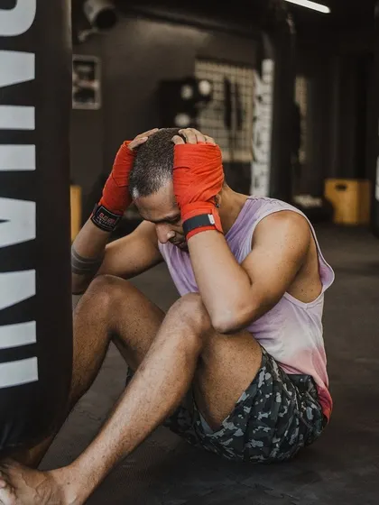 A moment of exhaustion and grit between rounds. This is where you dig deep and find the will to keep going.