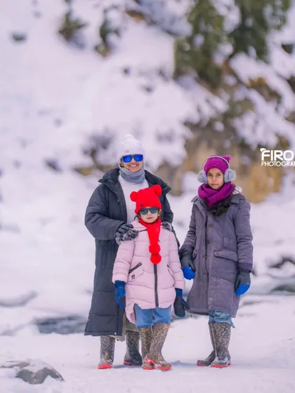 My wife and our two daughters posing for a photo in the snow. Even as a photographer, getting my own family to pose can be a challenge, but it's always worth it.