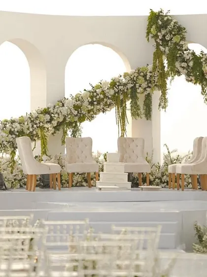 A wide shot of the modern, all-white mandap I designed at the Taj Holiday Village, Goa. The clean lines and ocean view create a picture of serene, contemporary elegance.