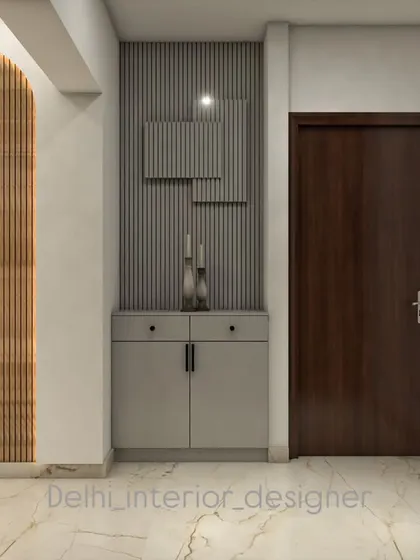 This 3D design showcases a simple yet elegant entryway or foyer concept. It features a combination of fluted and plain panels with a small storage cabinet, perfect for keeping the entrance tidy.