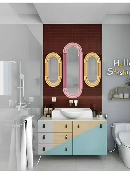 A playful and colorful bathroom design, perfect for a kids' bathroom. The vanity features a color-block design, and the triple mirrors in fun shapes add a whimsical touch.