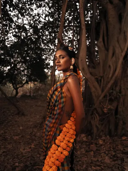 A moody, atmospheric portrait from the "தெய்வீகம்" series, using natural light to create a sense of quiet divinity.