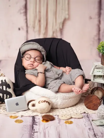 This "Boss Baby" is ready for business, complete with tiny glasses for a scholarly look.