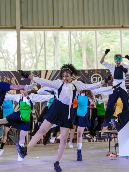The Open Style Batch in a high-kick line during their runner-up performance at Spectra 2025.