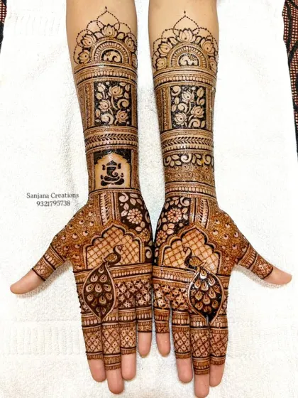 Another look at this gorgeous bridal design, showcasing the Ganesha and peacock motifs.