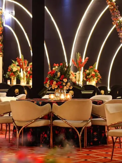 Another view of the seating arrangement, showing how the modern chairs and tables were placed in front of the glowing arch backdrop.