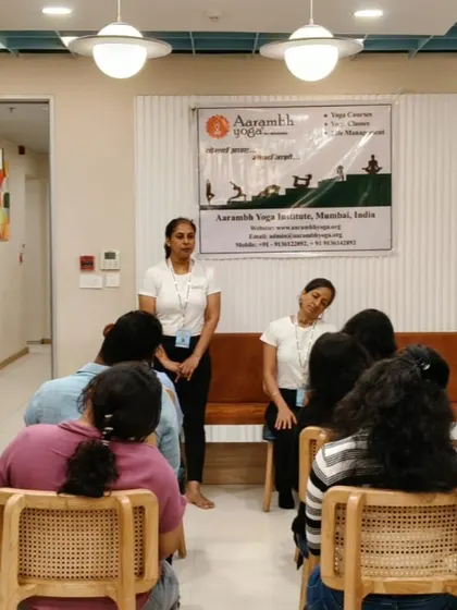 An instructor from my team demonstrates a gentle neck stretch during a corporate yoga session in Andheri, Mumbai. These simple movements are designed to release tension in the neck and shoulders, a common issue for desk workers.
