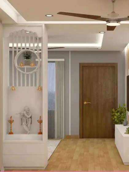 This design cleverly integrates a compact pooja unit into the foyer partition. It's a great space-saving solution that combines two functions in one elegant structure.
