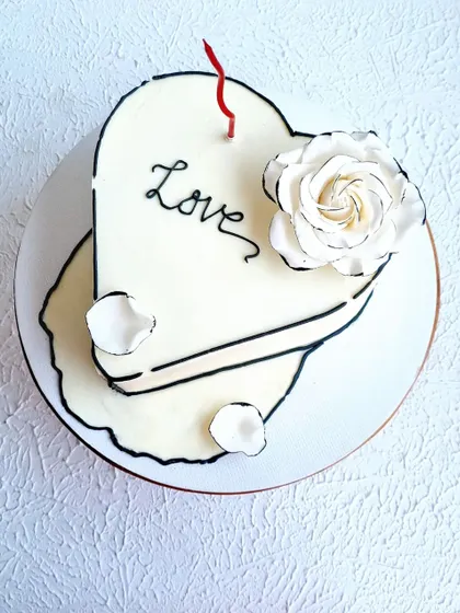 A top-down view of the heart-shaped comic cake.