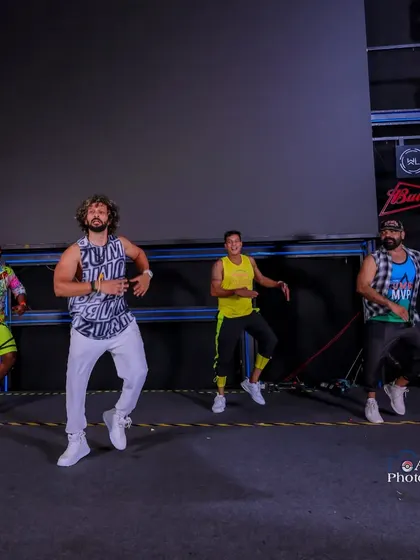 On stage with my fellow instructors during a major Zumba event. For larger events, I bring a team of talented presenters to ensure the energy is high from every angle.