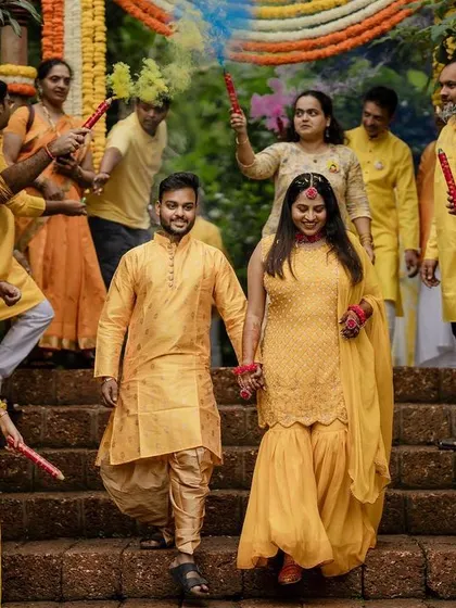 The grand entrance with colorful smoke bombs makes for an epic start to the Haldi festivities. We love capturing the energy and excitement of the wedding party.