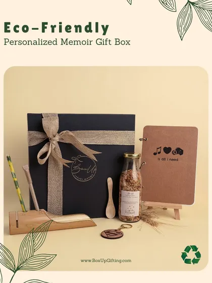 The Personalized Memoir Gift Box is an elegant, eco-friendly option. It features a custom-engraved notebook, a bamboo pen holder, and a jar of granola, all packed in a reusable box.