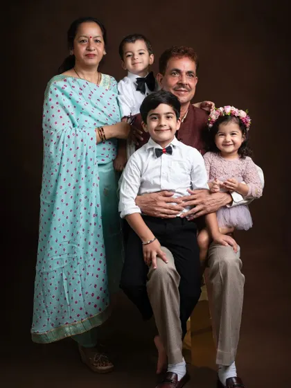 A wonderful multi-generational portrait, capturing three generations of love with grandparents and grandchildren.