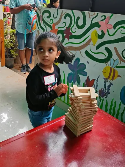 Even with a cast on his arm, this young builder was determined to create. It shows that the desire to build is powerful. He is exploring patterns and balance, proving that everyone can participate and achieve something they are proud of.