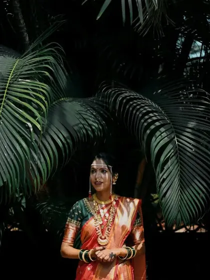 A portrait of the bride in the same stunning location, now smiling, showing the range of emotions on a wedding day.
