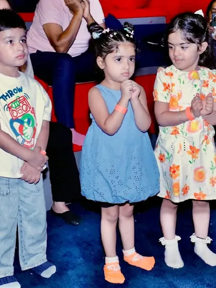 Young guests watch the entertainment with anticipation.