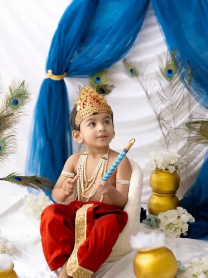 This little lord is looking right at the camera, ready for his close-up. The Janmashtami sessions are always filled with so much love and devotion.