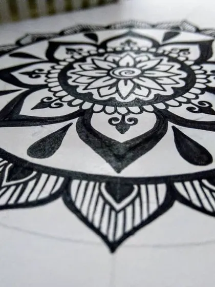 A mandala in the early stages of creation. After a break from art due to being sick, it felt good to get back to the familiar, peaceful process of drawing these patterns.