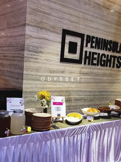 Our buffet setup for a corporate event at Peninsula Heights. We are experienced in catering within professional venues, ensuring a seamless integration with the location.