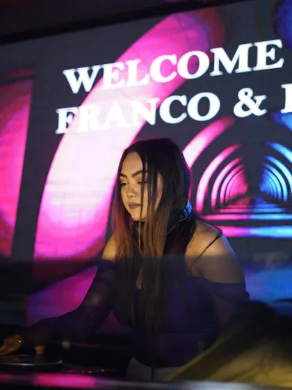 At the decks for a private event, with a custom "Welcome" message on the screen behind me.