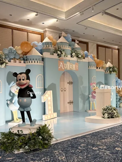 The Disneyland stage with Mickey Mouse and Donald Duck, showing the variety of beloved characters included in the decor.