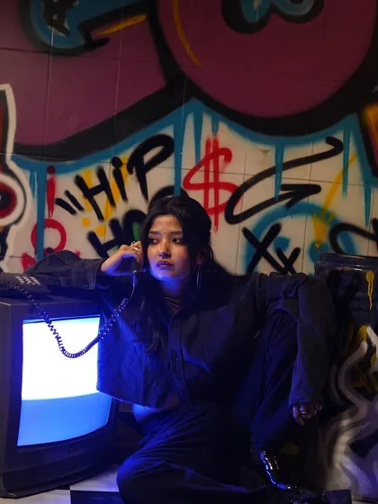 A model posing against the graffiti backdrop at Cosmic Studios. The artwork is designed to be an interactive and edgy set for fashion and creative photography.
