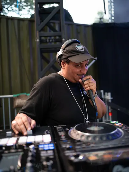 Behind the decks is where the magic starts. As a DJ and event producer, I'm hands-on with every detail, from the music selection to the final production, ensuring every party has the right vibe from start to finish.