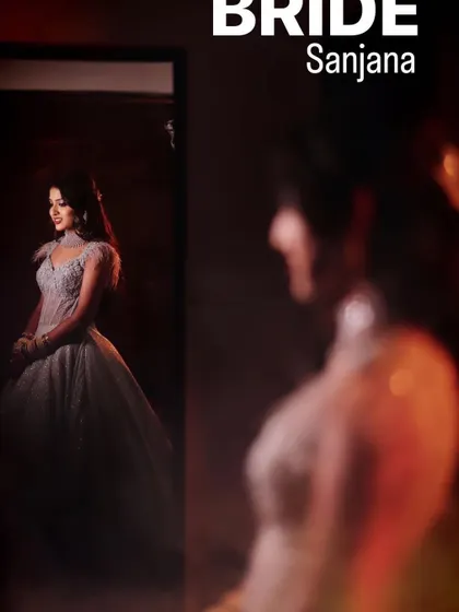 A creative shot capturing the bride's reflection as she gets ready for her reception. This style of photography adds a layer of storytelling, focusing on the moments of anticipation before the main event.