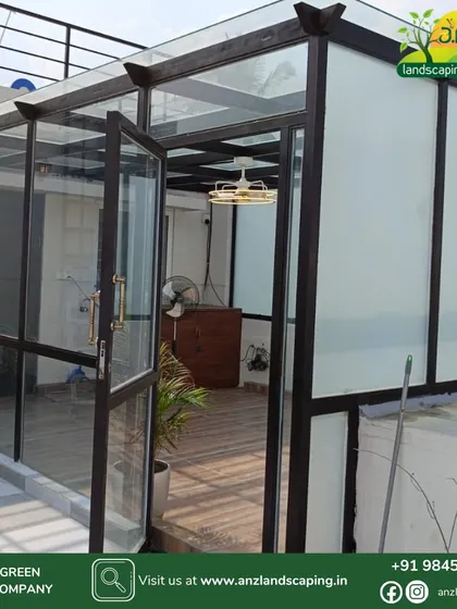 This is an all-weather glass sunroom we designed and executed for a client in Bengaluru. Featuring a high-grade mild steel frame, clear and frosted toughened glass, and wooden flooring, it serves as a premium, year-round extension to the home.