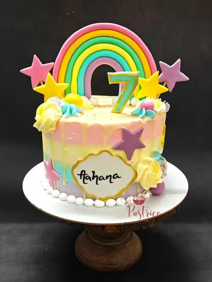 A vibrant rainbow and stars cake to brighten up any birthday. This colourful Dutch truffle cake is perfect for a cheerful and happy celebration.