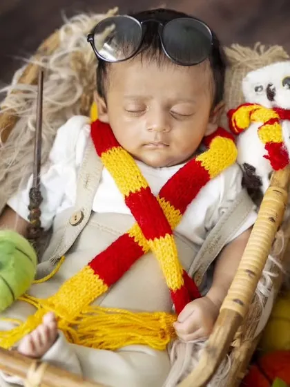 For all the Potterheads, this detailed Harry Potter newborn setup includes books, pumpkins, and even a tiny Hedwig.