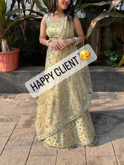 The perfect outfit for a sunny, outdoor event. This happy client is glowing in her light green floral rental lehenga.