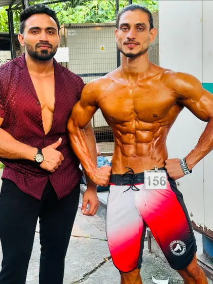 Posing with my client backstage. The moments before stepping on stage are filled with focus.