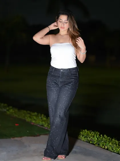 A candid-style night shot, capturing a natural and relaxed moment.