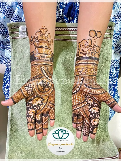 A full view of a custom baby shower mehendi. One arm features adorable animals in a car, while the other has elephants with balloons, all combined with traditional floral and lotus patterns.