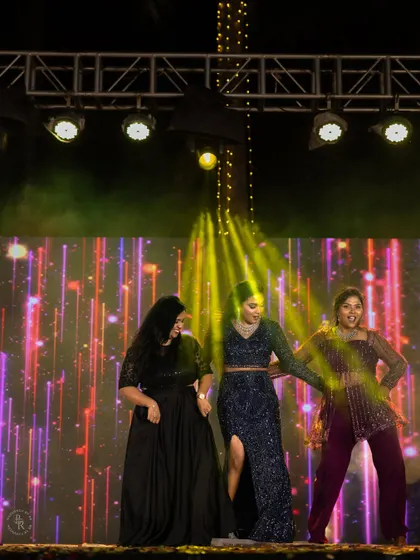 The bride and her friends take over the stage for a fun-filled dance performance at the Sangeet.