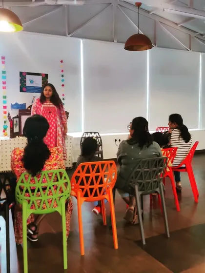 A view from the back shows a typical workshop setup. Parents and children sit together, sharing the experience, which is fundamental to the parent-child bonding aspect of my sessions.