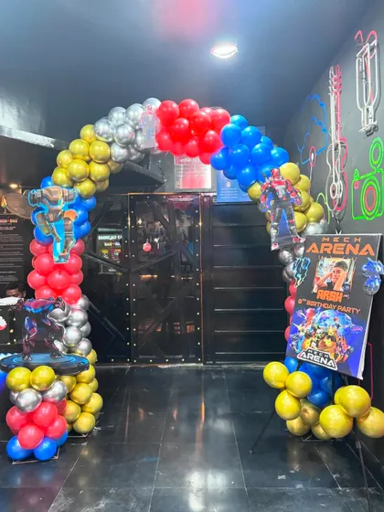 The entrance arch for the Transformer-themed party, setting the stage for an action-filled celebration with character posters and colorful balloons.
