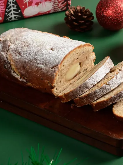 My Christmas stollen, a traditional German fruit bread with a marzipan center, dusted with powdered sugar.