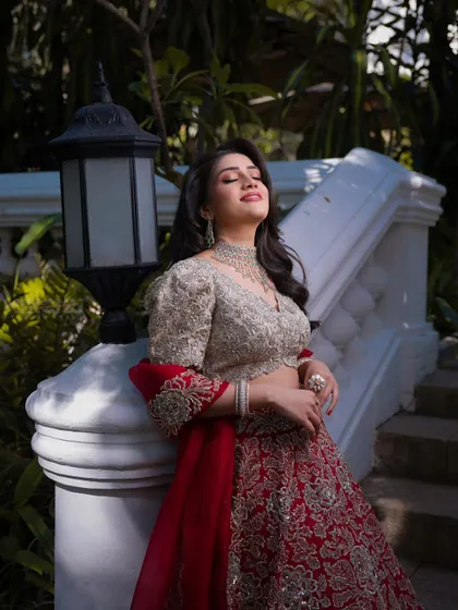 Mahima basking in the sunlight. Her makeup is luminous and glowing, showcasing a healthy and radiant complexion that is perfect for outdoor photography.