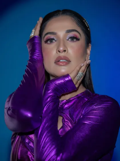 A beautiful portrait that showcases the flawless skin and the bold eye makeup.